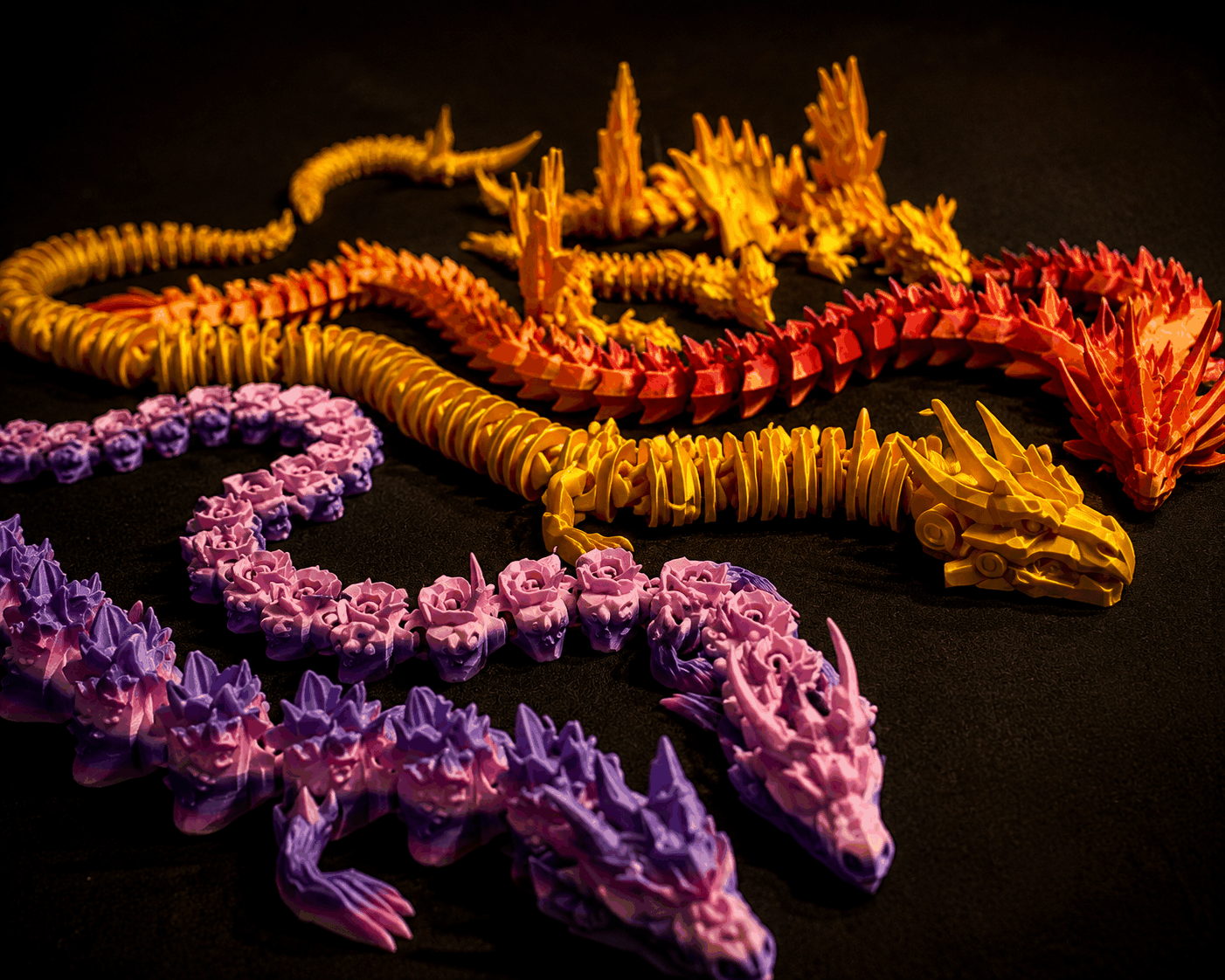 Colorful articulated dragon prints on a market display table
