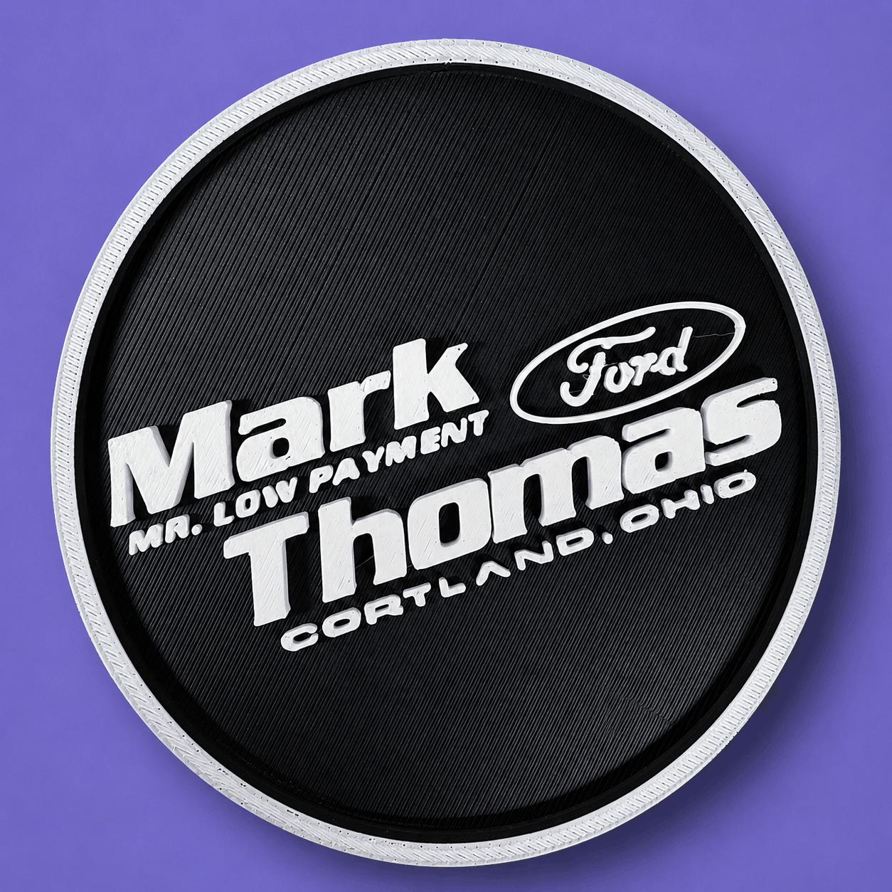 A dimensional black and white Mark Thomas Ford coaster.