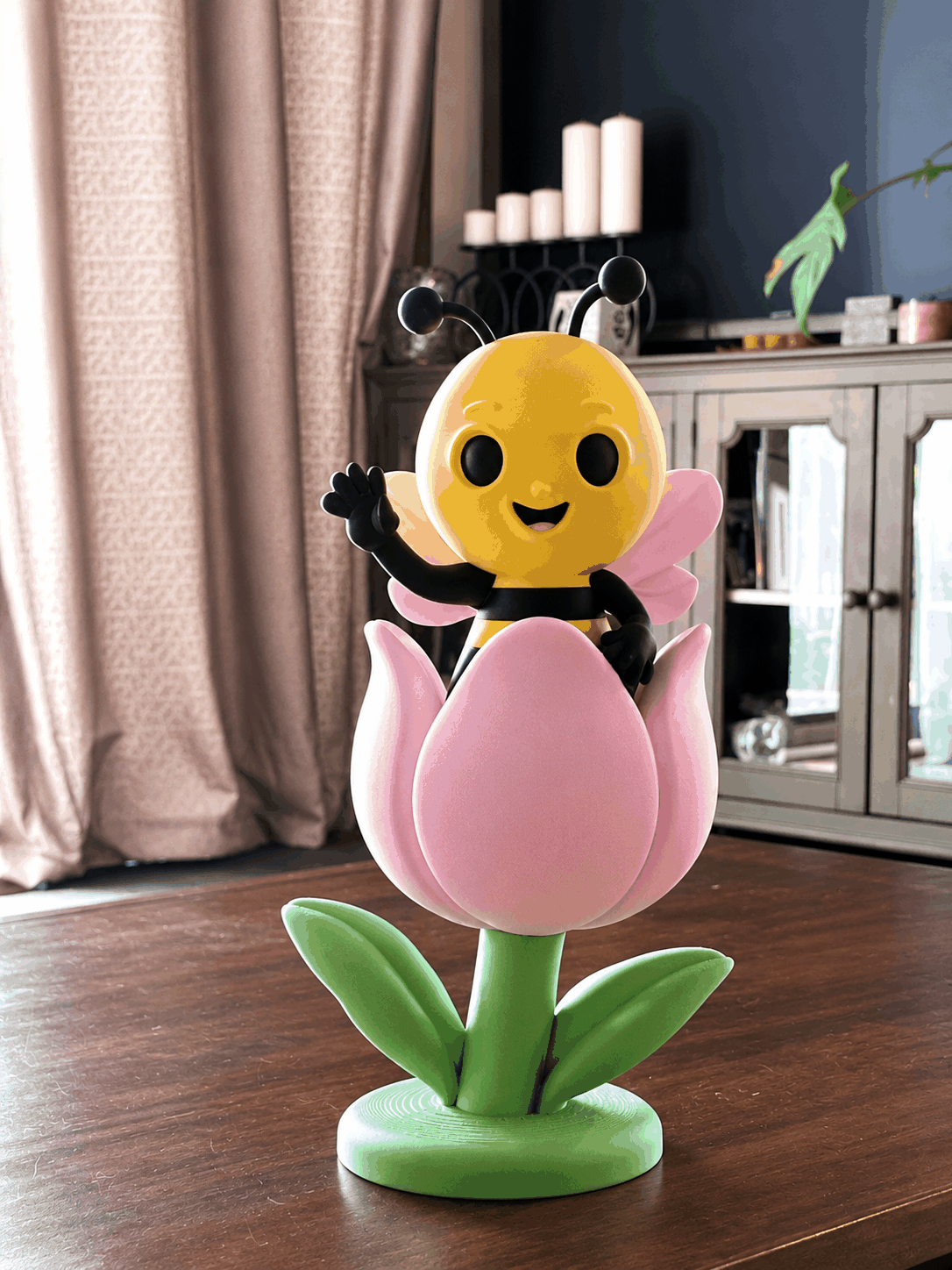 Poly, the OliPoly bee, printed as a colorful dimensional figure.