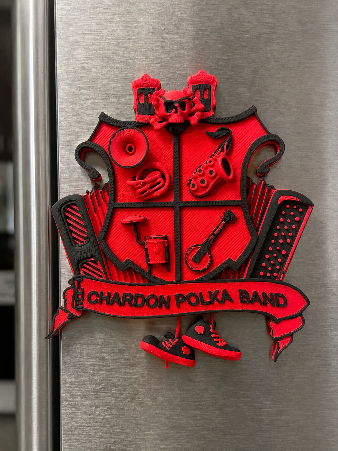 A custom Chardon Polka Band magnet displayed on a refrigerator.