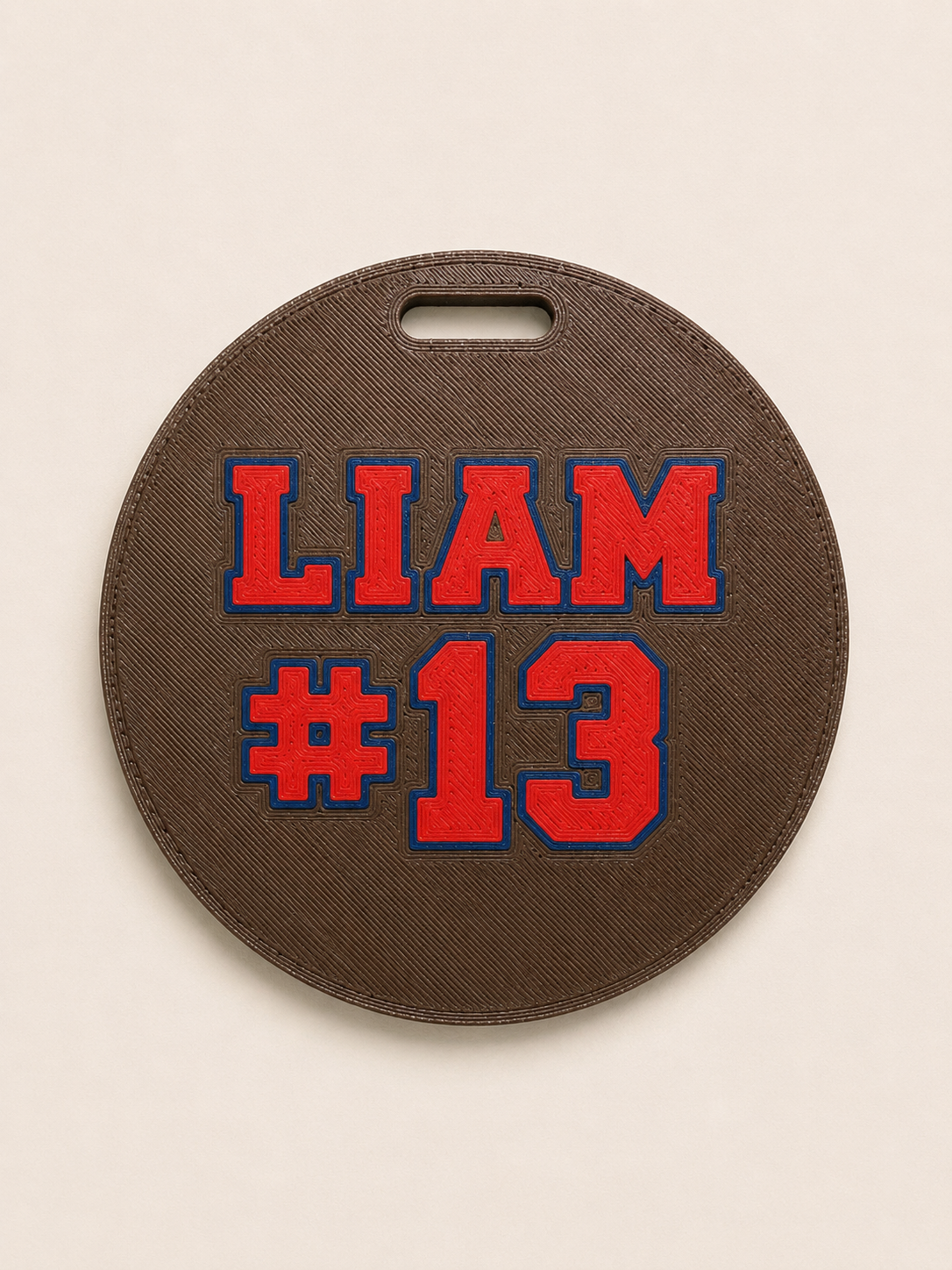 Personalized football bag tag back example with Liam and number 13