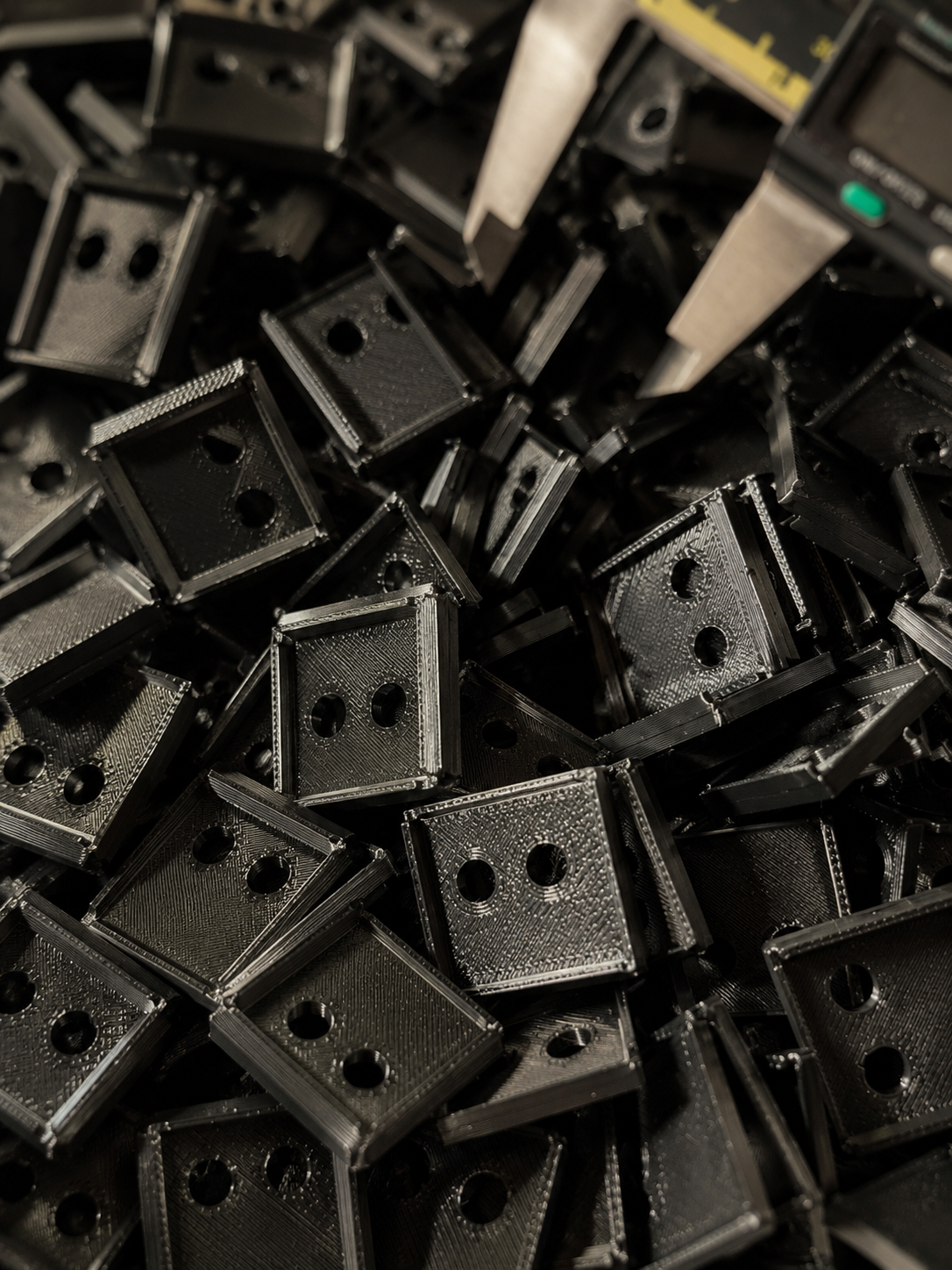Small batch 3D printed parts arranged for production checking