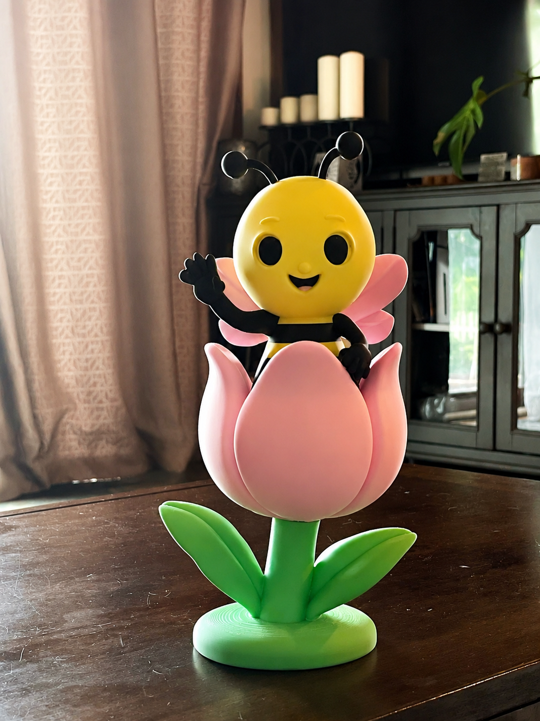 Poly the bee 3D print sitting in a flower